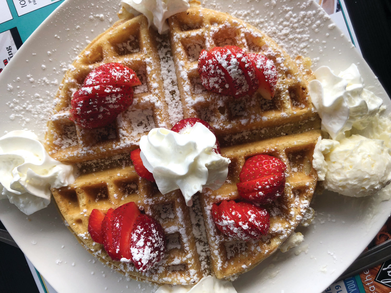 Breakfast at Tiffany’s, the brainchild and namesake of owner Tiffany Rossi, is the perfect place to start your day with homestyle, made-to-order breakfasts ~ seven days a week. Dig your teeth into this fluffy waffle, dotted with fresh whipped cream and butter.